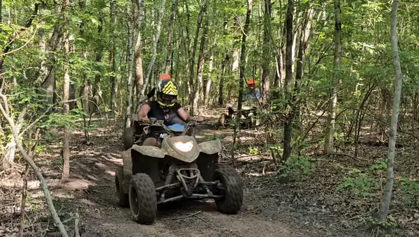 Smiling riders on an NJ ATV tour at NJ ATV Rentals