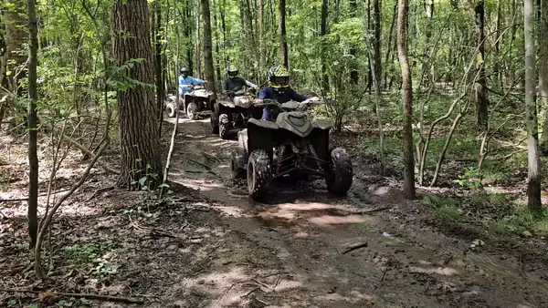ATV group riding through the woods at NJ ATV Rentals