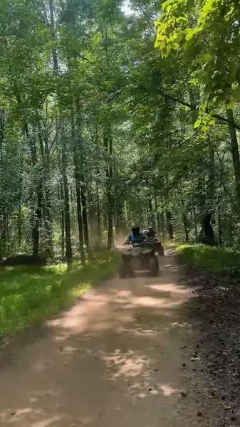 Smiling riders on an NJ ATV tour at NJ ATV Rentals