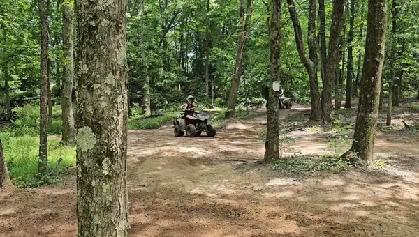 Quad riders cruising a sandy trail at NJ ATV Rentals
