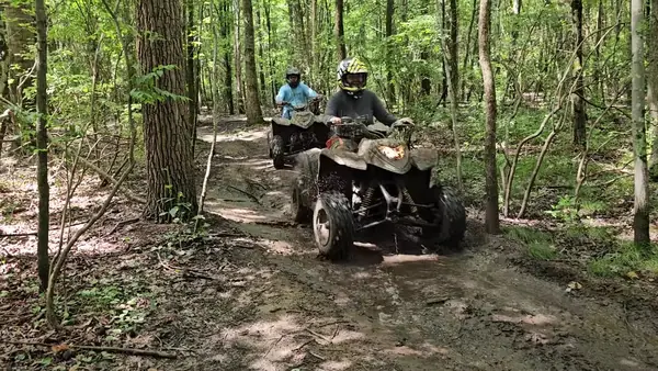 Riders on a wooded ATV trail at NJ ATV Rentals