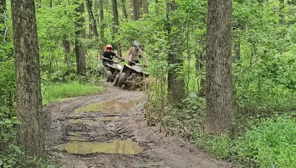 Smiling riders on an NJ ATV tour at NJ ATV Rentals