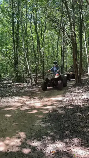 Riders on a wooded ATV trail at NJ ATV Rentals