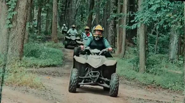Smiling riders on an NJ ATV tour at NJ ATV Rentals