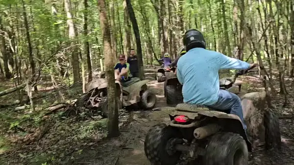 Quad riders cruising a sandy trail at NJ ATV Rentals