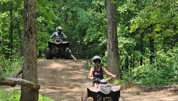 Quad riders cruising a sandy trail at NJ ATV Rentals