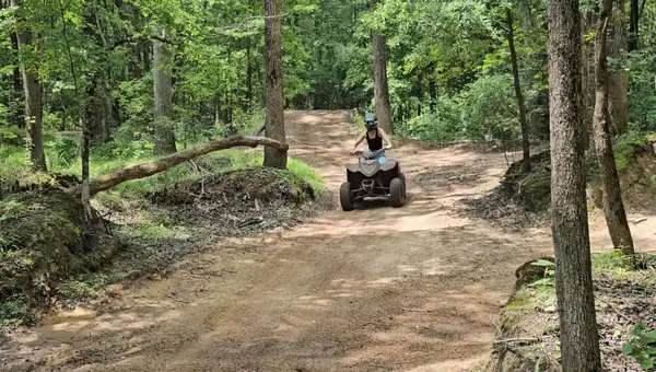 Riders on a wooded ATV trail at NJ ATV Rentals